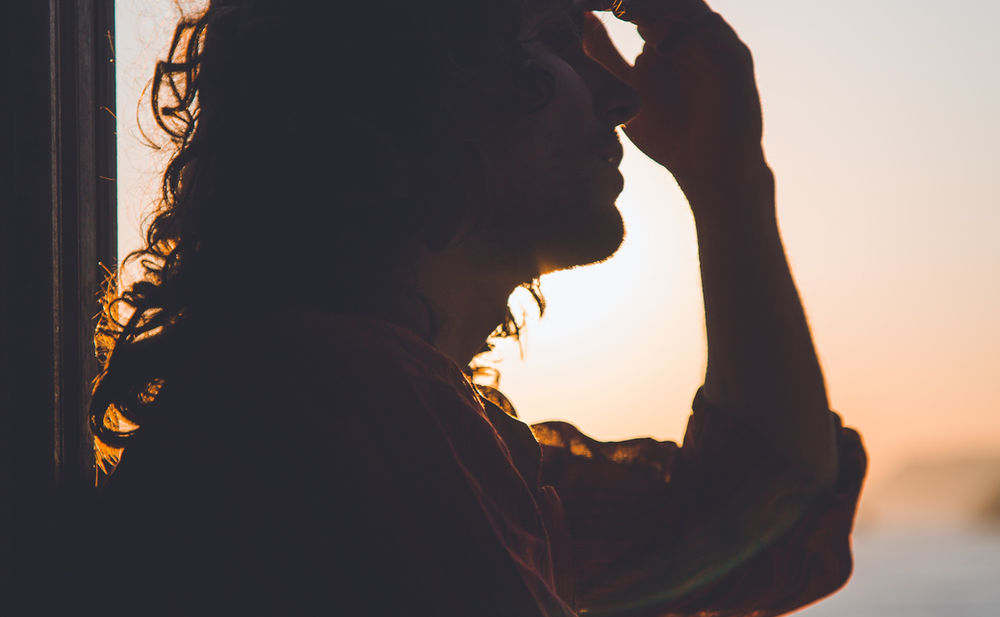 A person resting with migraine discomfort